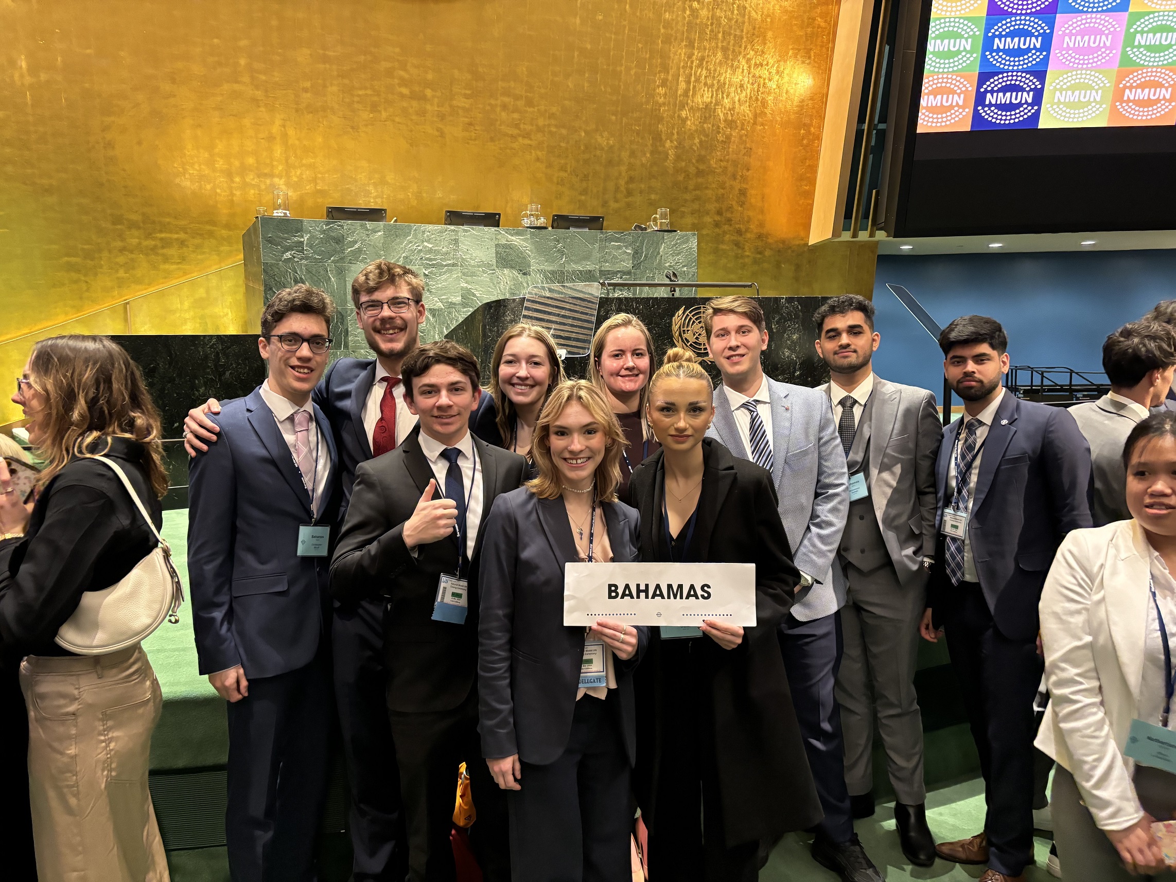 Model UN Delegation holding Bahamas sign